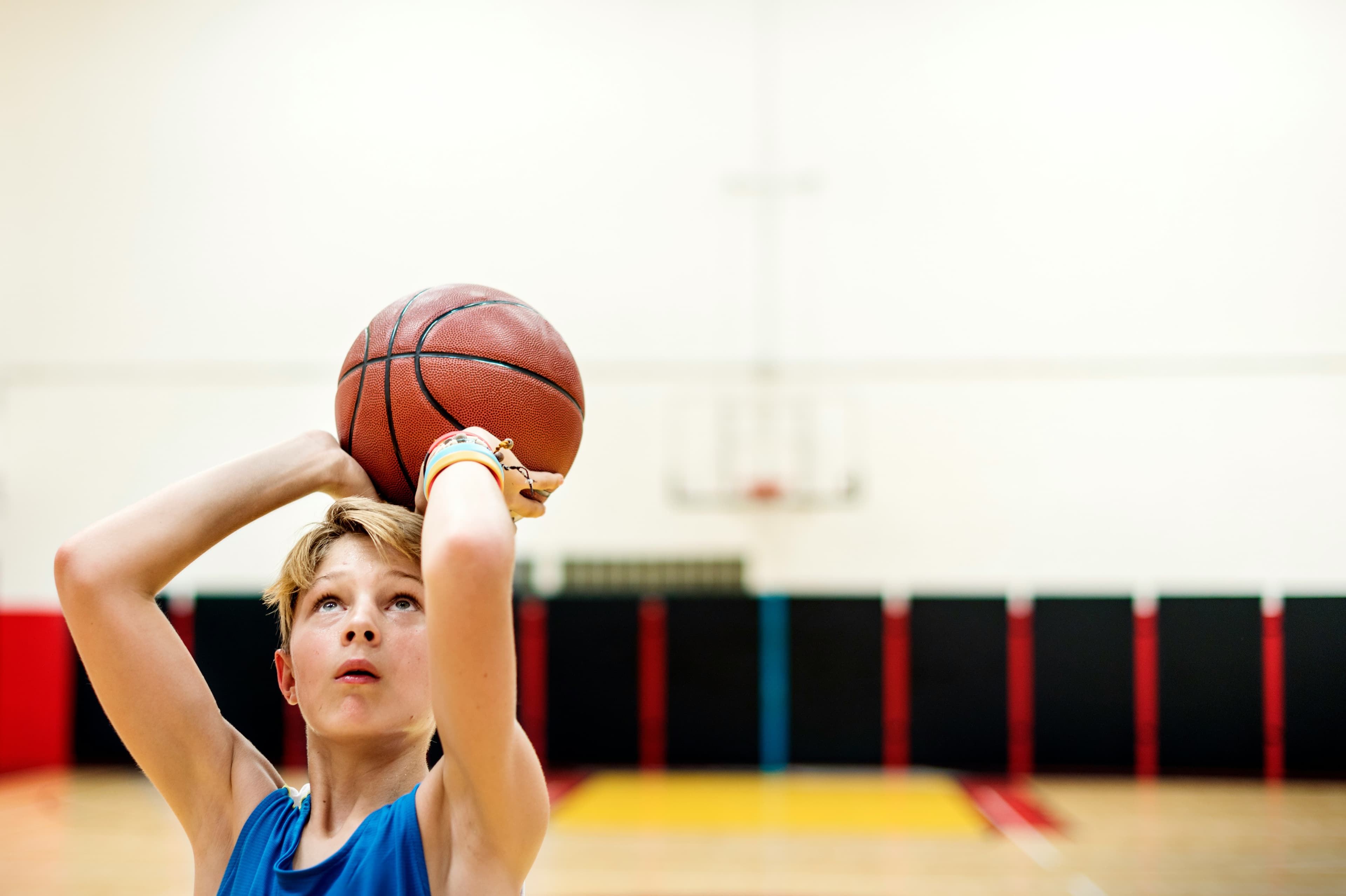Young basketball players practicing shooting in Winnipeg